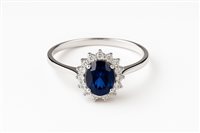 Anello da donna in oro bianco 18 kt con zircone blu ovale 5x8 e contorno di zirconi bianchi – Misura 14 – 2.40 g – Idee Preziose dal 1987 - IP.AK18B/9